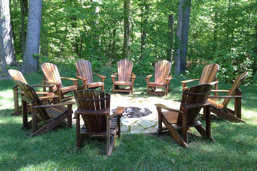 10 brown adirondack chairs around firepit