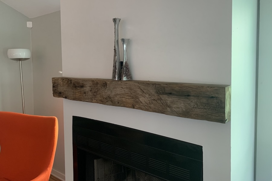 wood mantle above fireplace